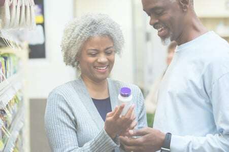 older couple looking at supplements